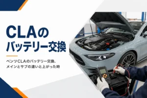 整備工場でバッテリーを点検している手元